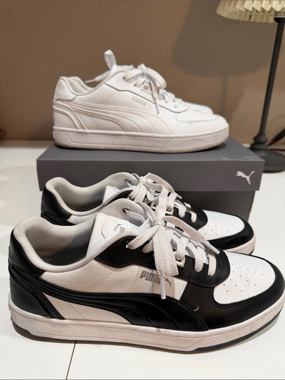 Puma Low-Top Sneakers in White & Black Caven 2.0